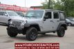 2016 Jeep Wrangler Unlimited 4WD 4dr Willys Wheeler - 22909847 - 0