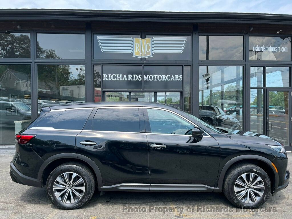 2023 INFINITI QX60 PURE AWD - Mineral Black exterior view 2