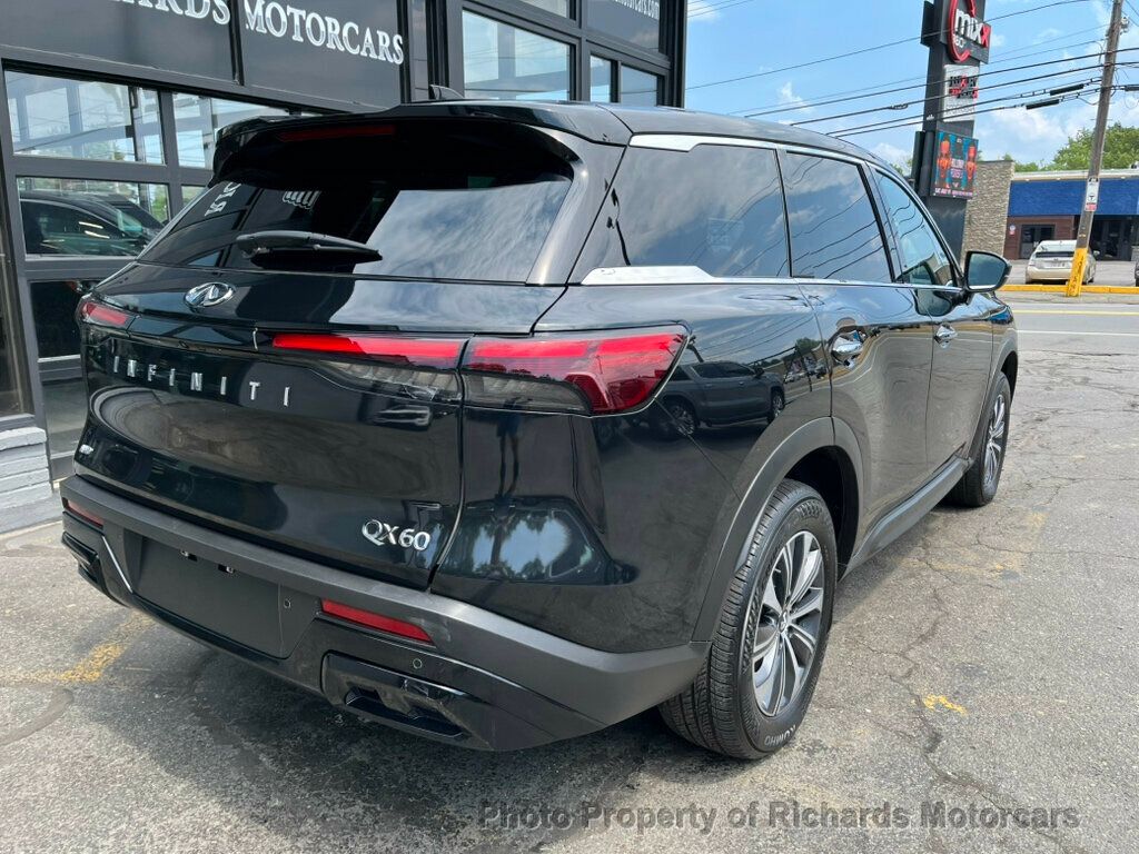 2023 INFINITI QX60 PURE AWD - Mineral Black exterior view 4