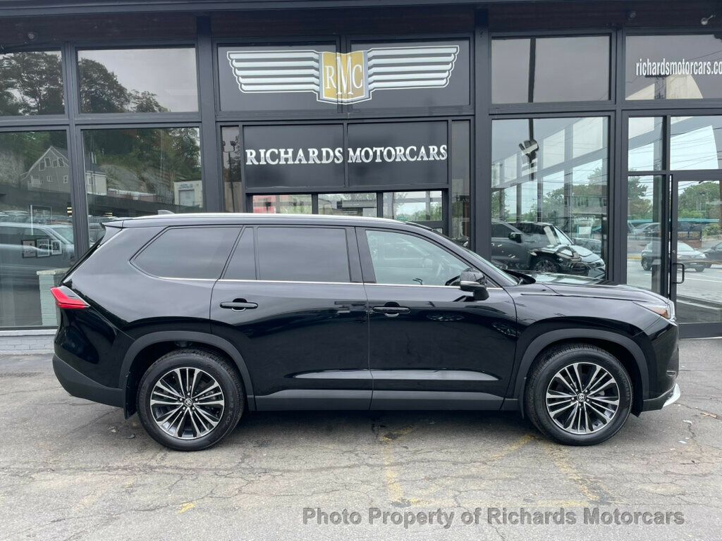 2024 Toyota Grand Highlander Platinum AWD - Midnight Black Metallic exterior view 2