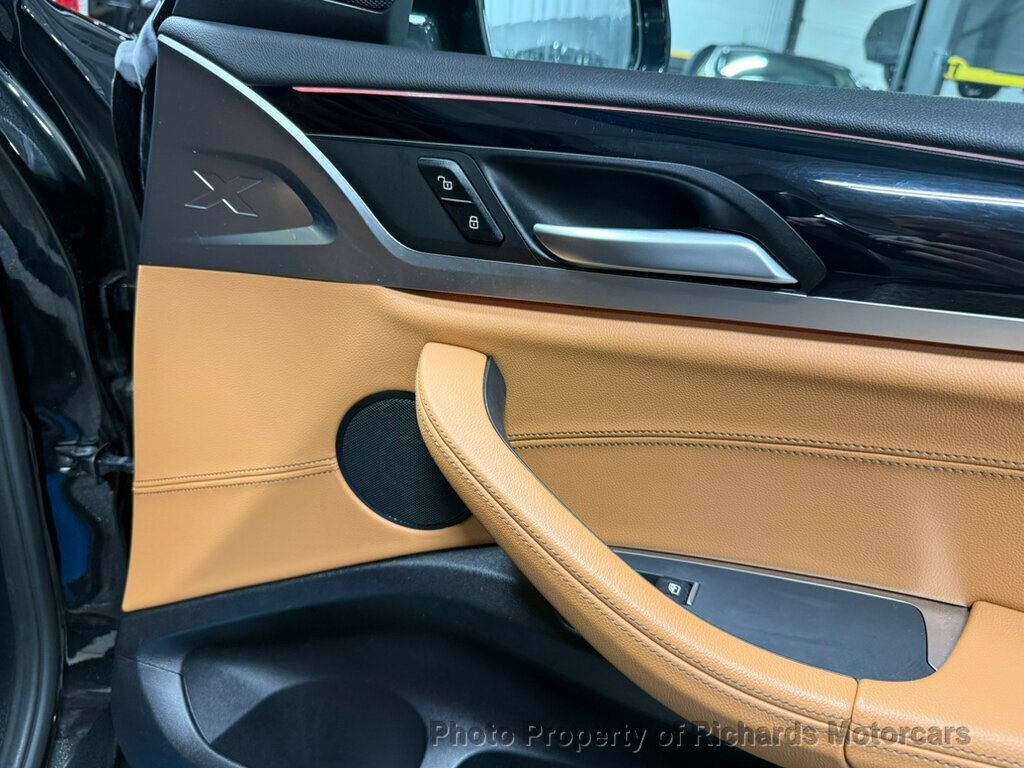 2020 BMW X4 xDrive30i Sports Activity - Black Sapphire Metallic exterior view 20