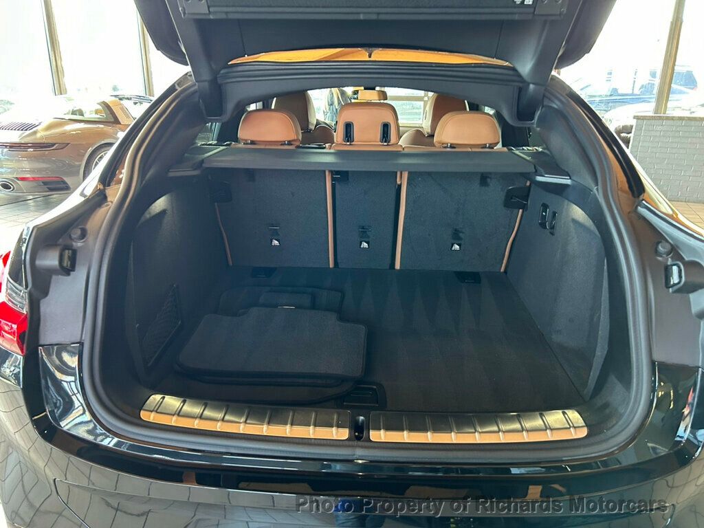 2025 BMW X4 xDrive30i Sports Activity - Black Sapphire Metallic exterior view 17