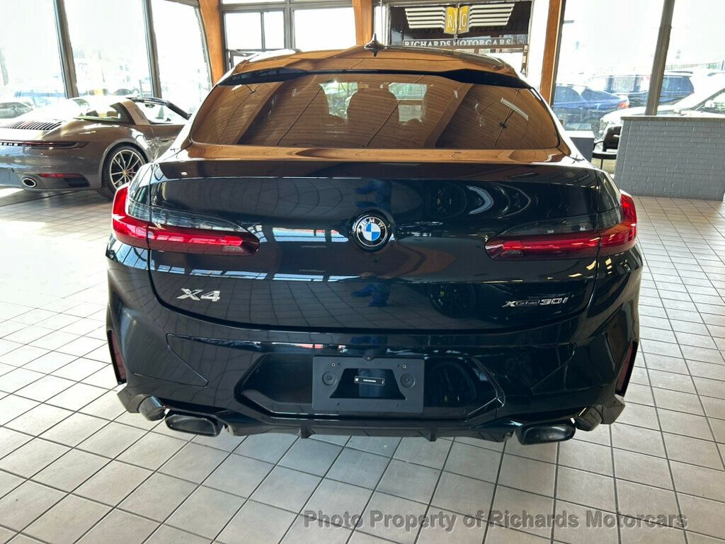 2025 BMW X4 xDrive30i Sports Activity - Black Sapphire Metallic exterior view 6