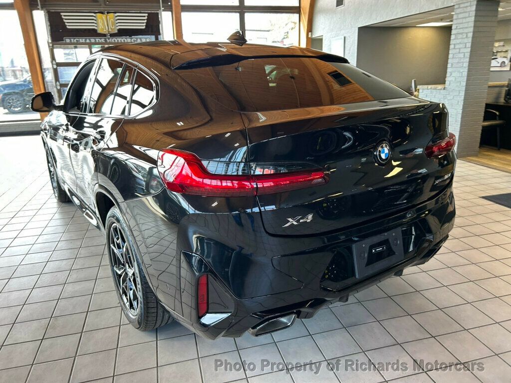 2025 BMW X4 xDrive30i Sports Activity - Black Sapphire Metallic exterior view 7