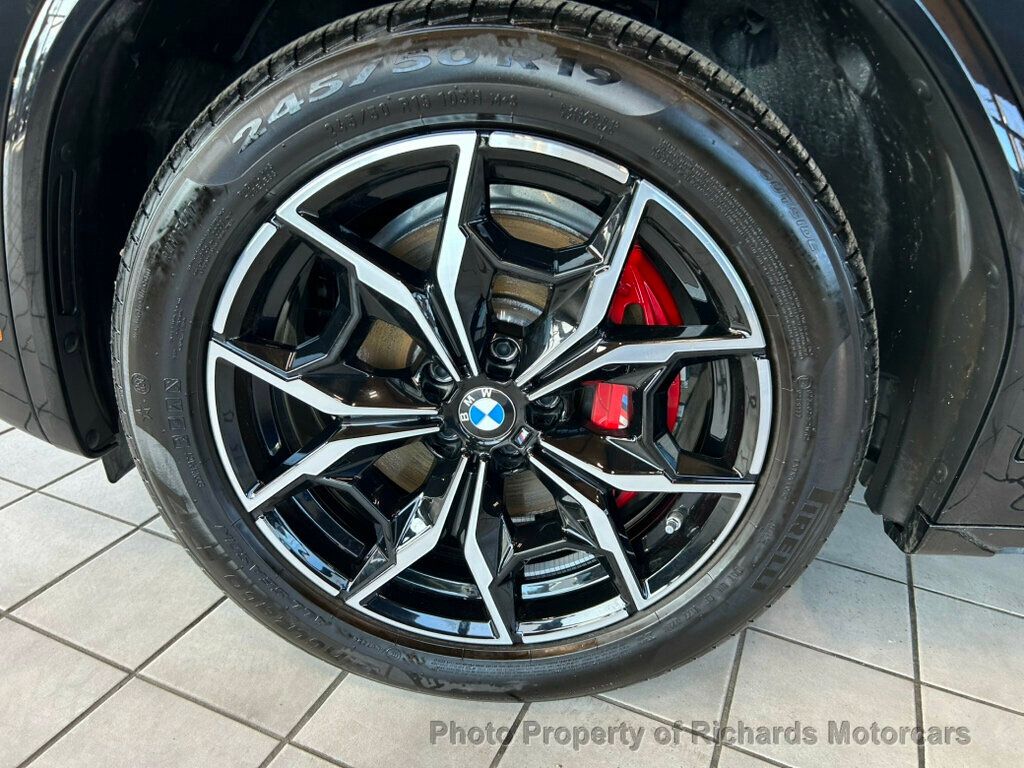 2025 BMW X4 xDrive30i Sports Activity - Black Sapphire Metallic exterior view 9