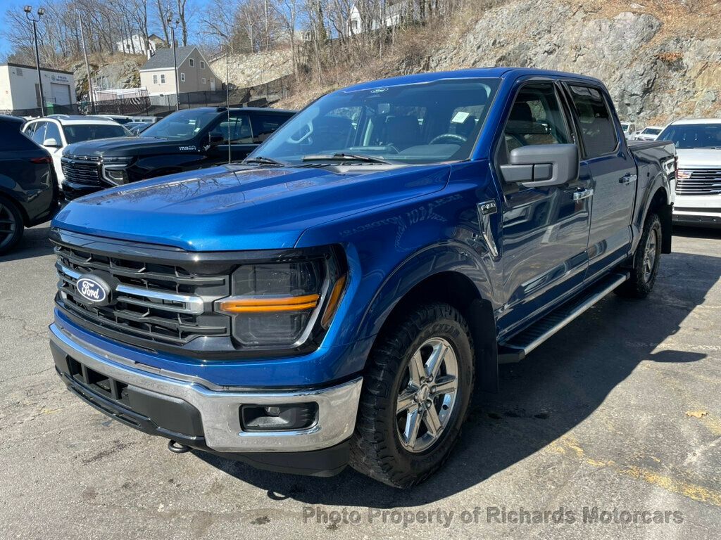 2024 Ford F-150 XLT 4WD SuperCrew 5.5' Box - Antimatter Blue Metallic exterior view 5