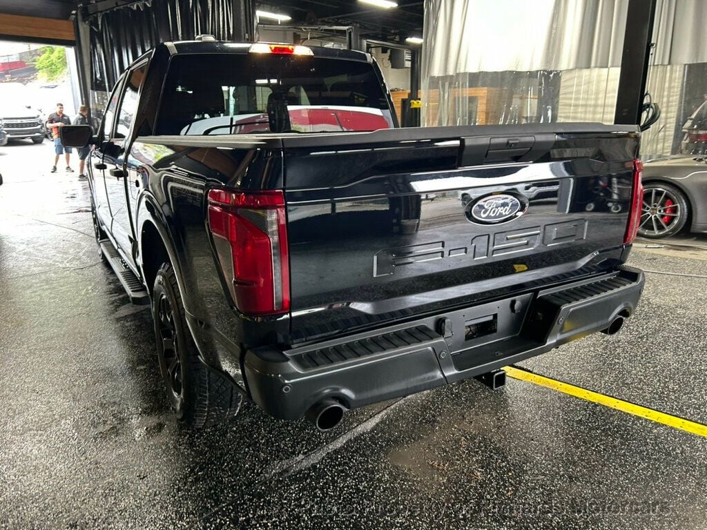 2024 Ford F-150 STX 4WD SuperCrew 5.5' Box - Agate Black Metallic exterior view 5
