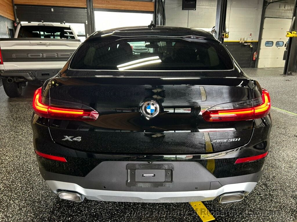 2023 BMW X4 xDrive30i Sports Activity - Jet Black exterior view 4