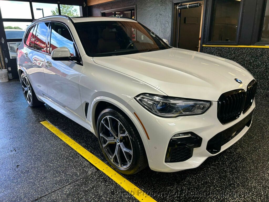 2021 BMW X5 xDrive40i Sports Activity Vehicle - Mineral White Metallic exterior view 2