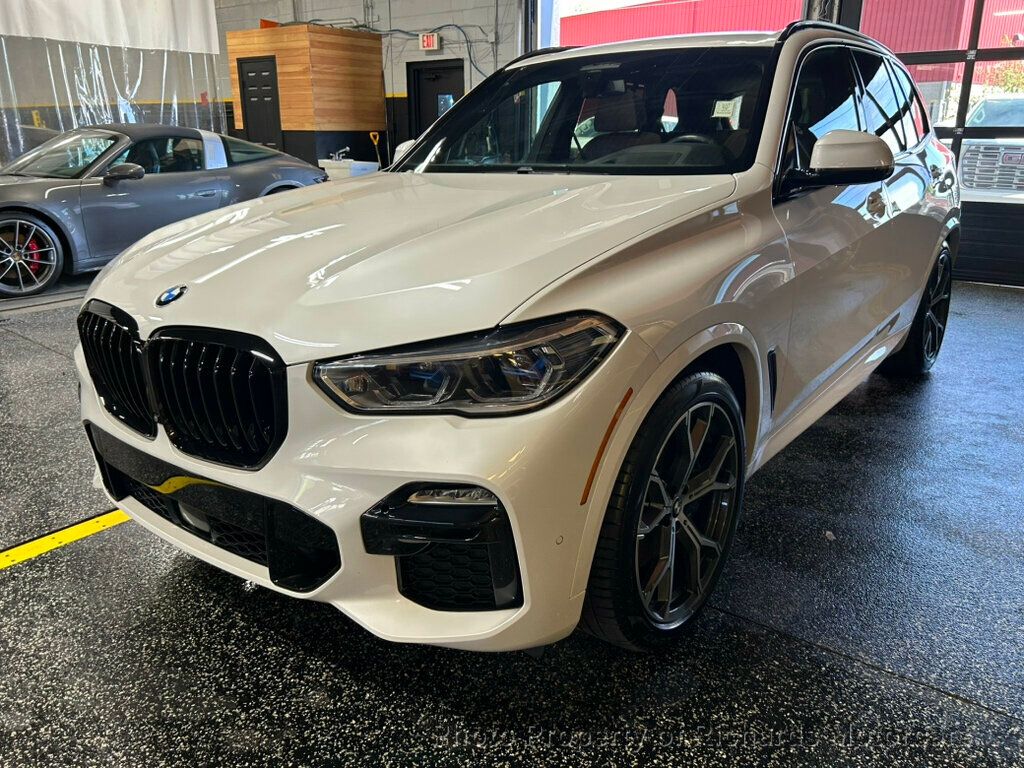2021 BMW X5 xDrive40i Sports Activity Vehicle - Mineral White Metallic exterior view 6