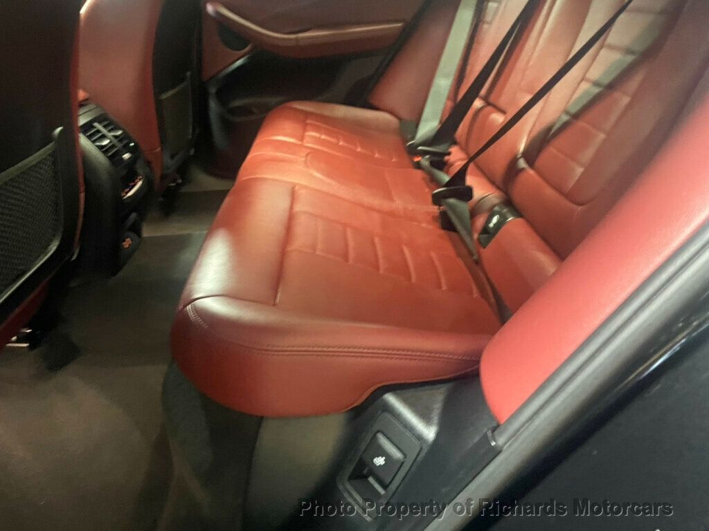 2020 BMW X4 xDrive30i Sports Activity - Black Sapphire Metallic exterior view 14
