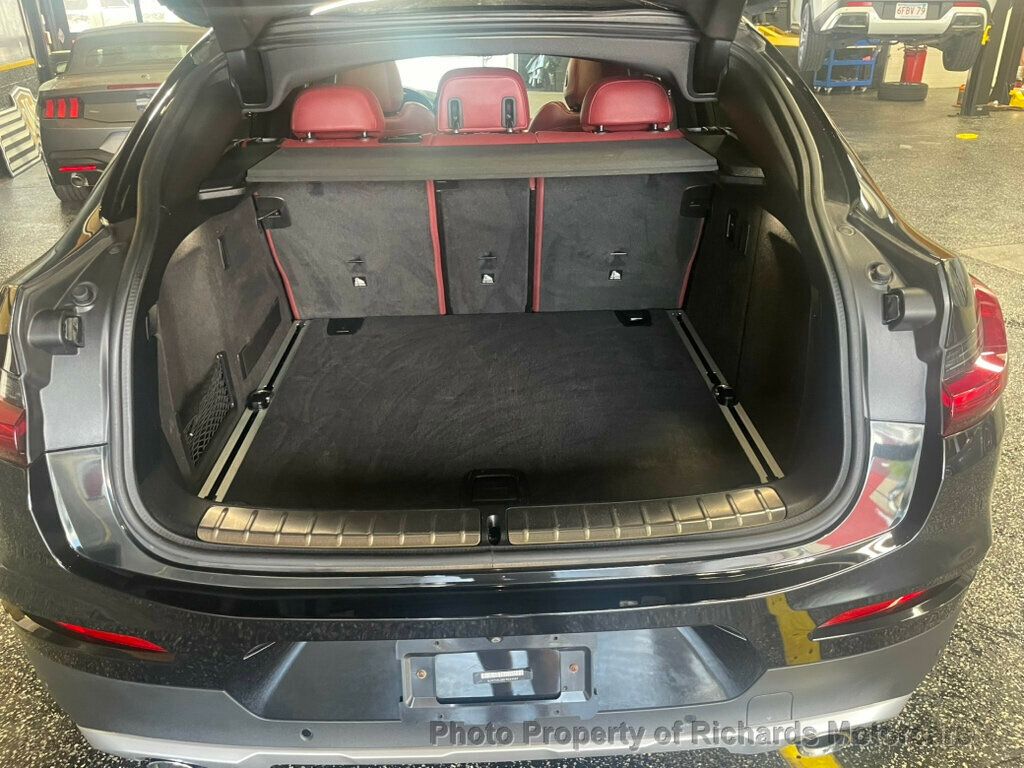 2020 BMW X4 xDrive30i Sports Activity - Black Sapphire Metallic exterior view 16