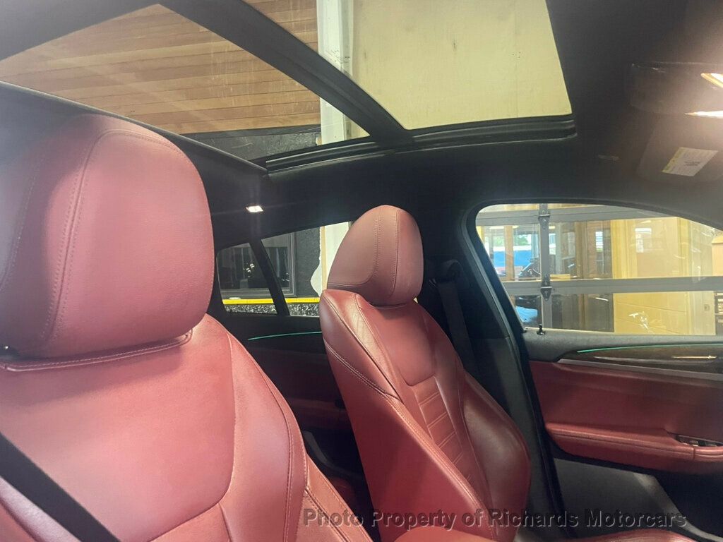 2020 BMW X4 xDrive30i Sports Activity - Black Sapphire Metallic exterior view 19