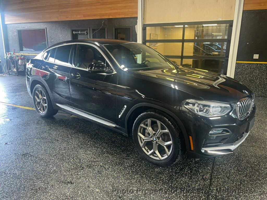 2020 BMW X4 xDrive30i Sports Activity - Black Sapphire Metallic exterior view 1