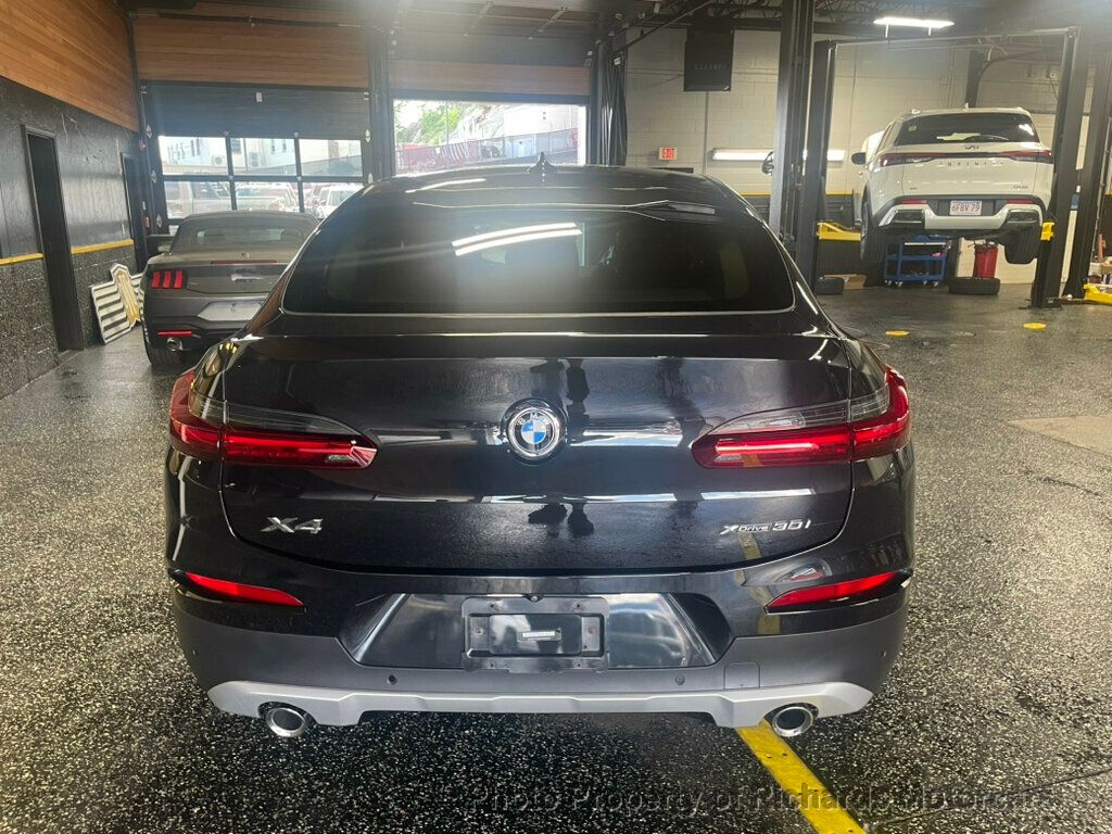 2020 BMW X4 xDrive30i Sports Activity - Black Sapphire Metallic exterior view 5