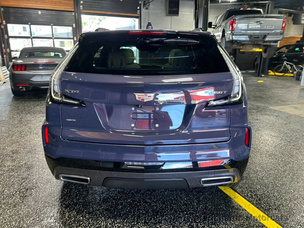 2024 Cadillac XT4 AWD 4dr Sport - Midnight Sky Metallic exterior view 4
