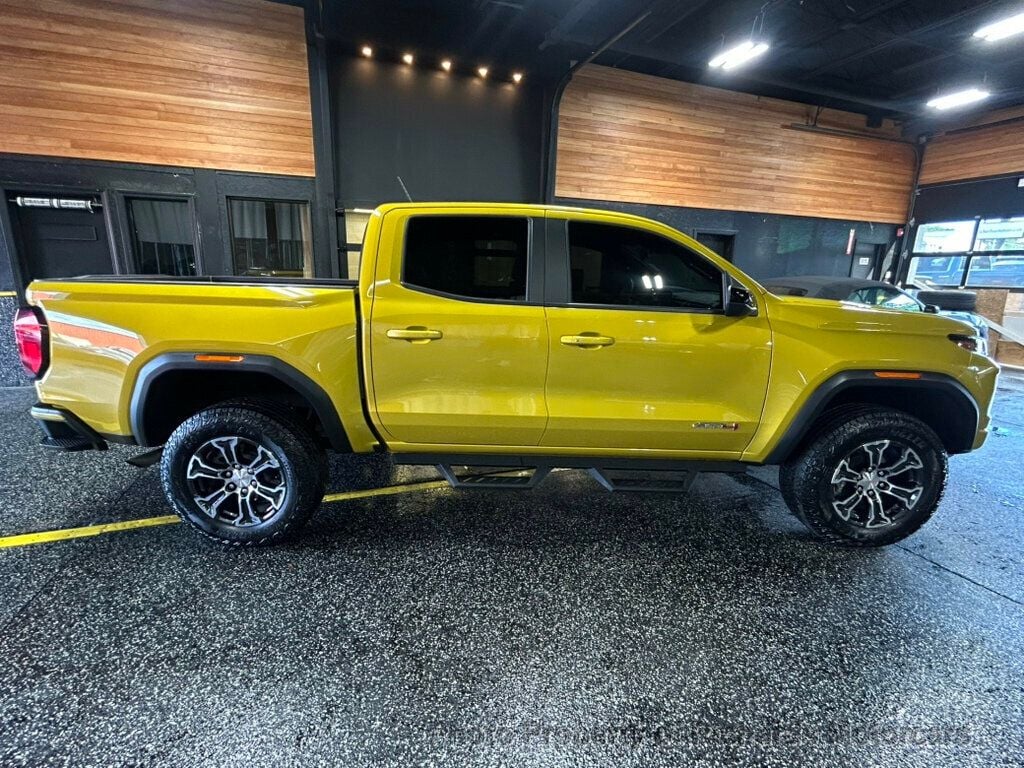 2024 GMC Canyon 4WD Crew Cab AT4 - Deep Bronze Metallic exterior view 3
