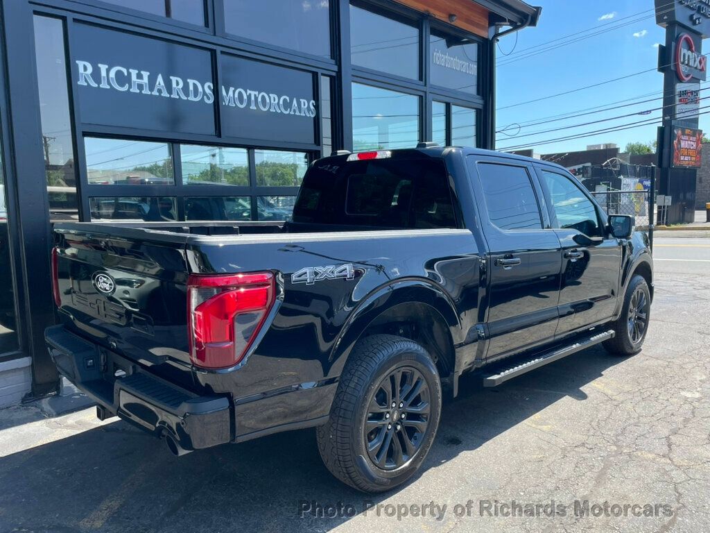 2024 Ford F-150 XLT 4WD SuperCrew 5.5' Box - Agate Black Metallic exterior view 2