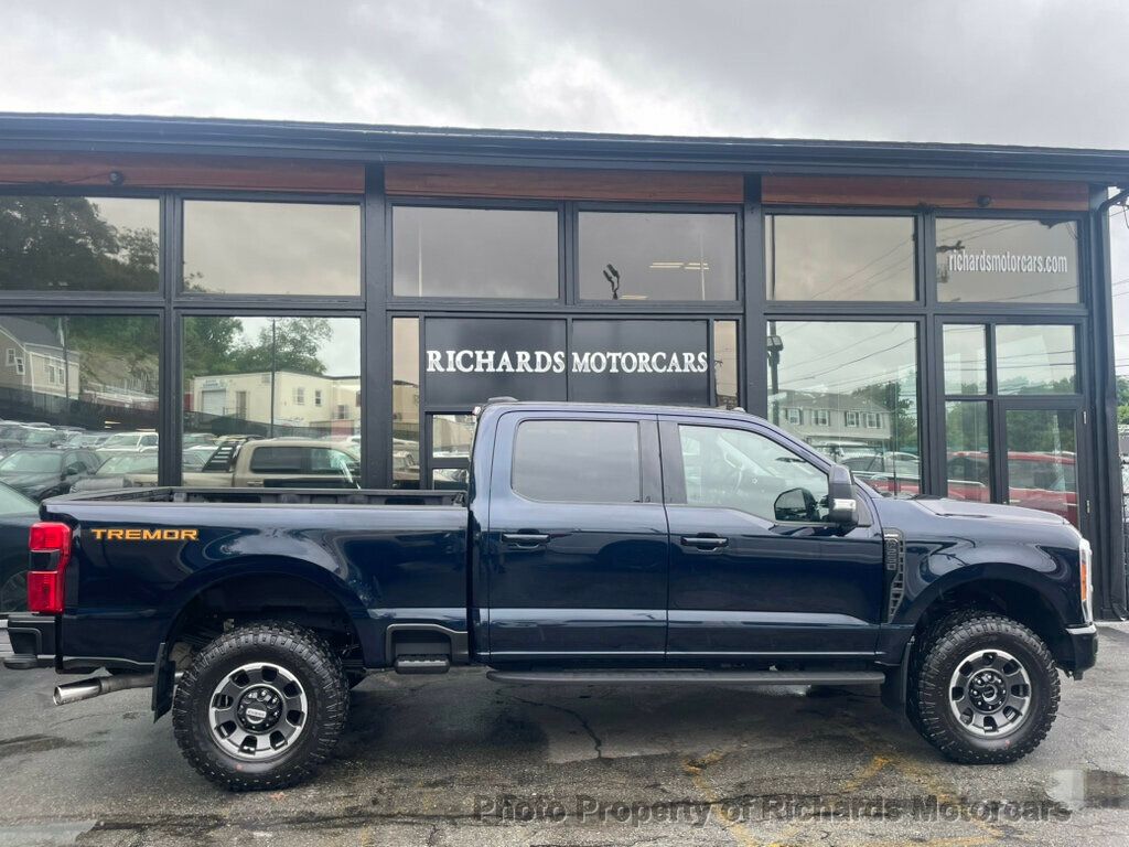 2023 Ford Super Duty F-250 SRW LARIAT 4WD Crew Cab 6.75' Box - Antimatter Blue Metallic exterior view 2