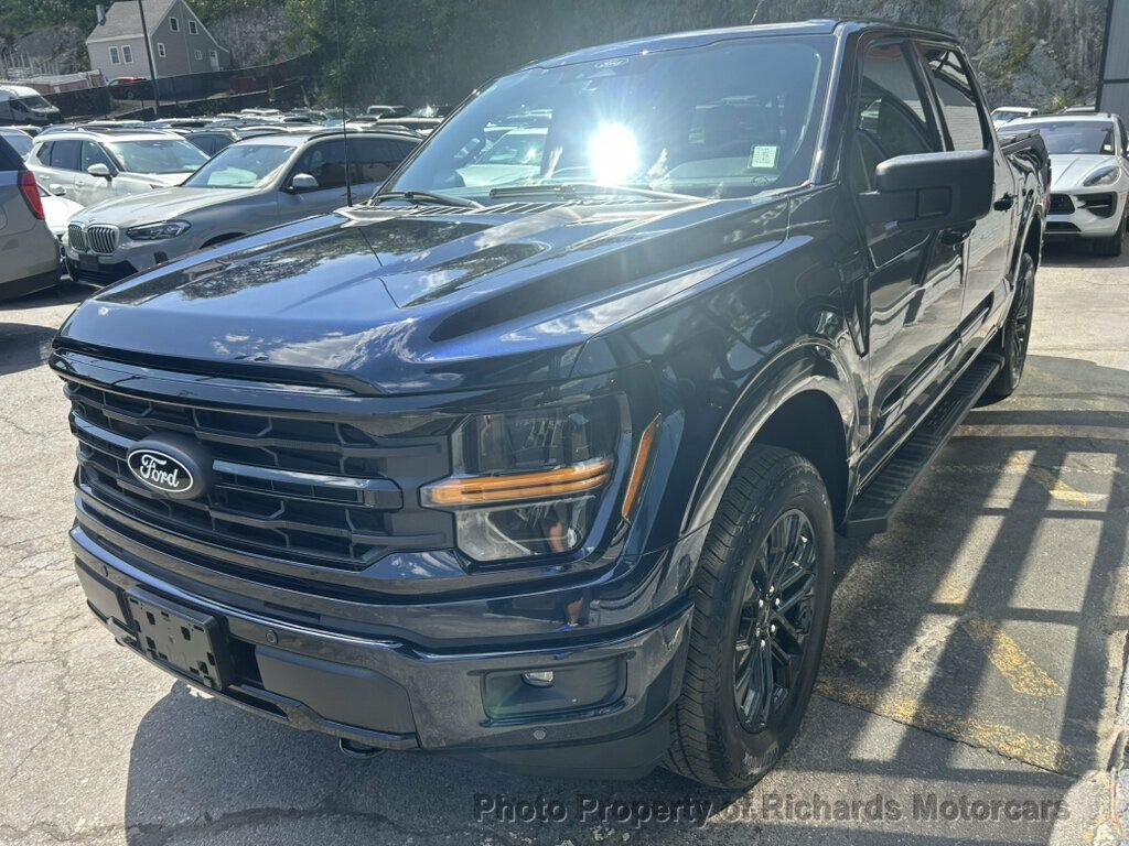 2024 Ford F-150 XLT 4WD SuperCrew 5.5' Box - Atlas Blue Metallic exterior view 5