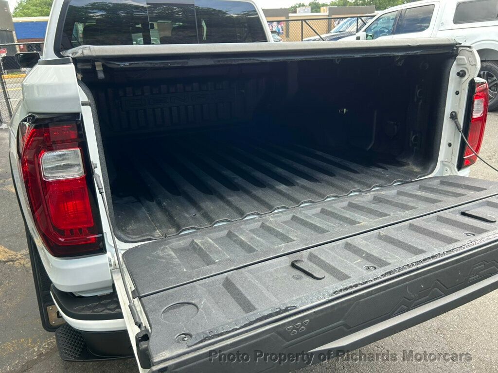 2024 GMC Canyon 4WD Crew Cab Denali - Summit White exterior view 11