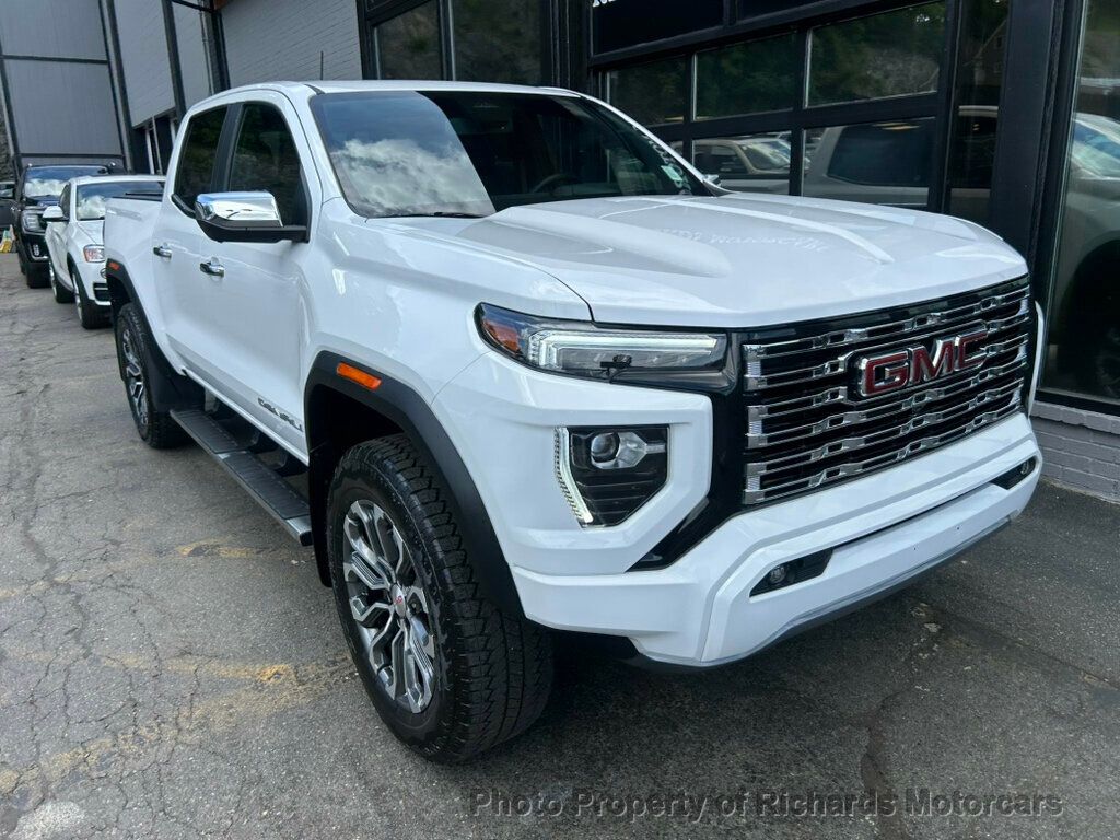 2024 GMC Canyon 4WD Crew Cab Denali - Summit White exterior view 7