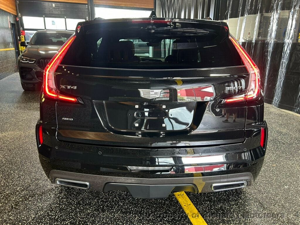 2024 Cadillac XT4 AWD 4dr Sport - Stellar Black Metallic exterior view 3