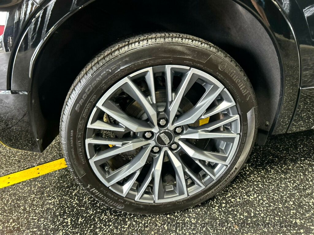 2024 Cadillac XT4 AWD 4dr Sport - Stellar Black Metallic exterior view 9