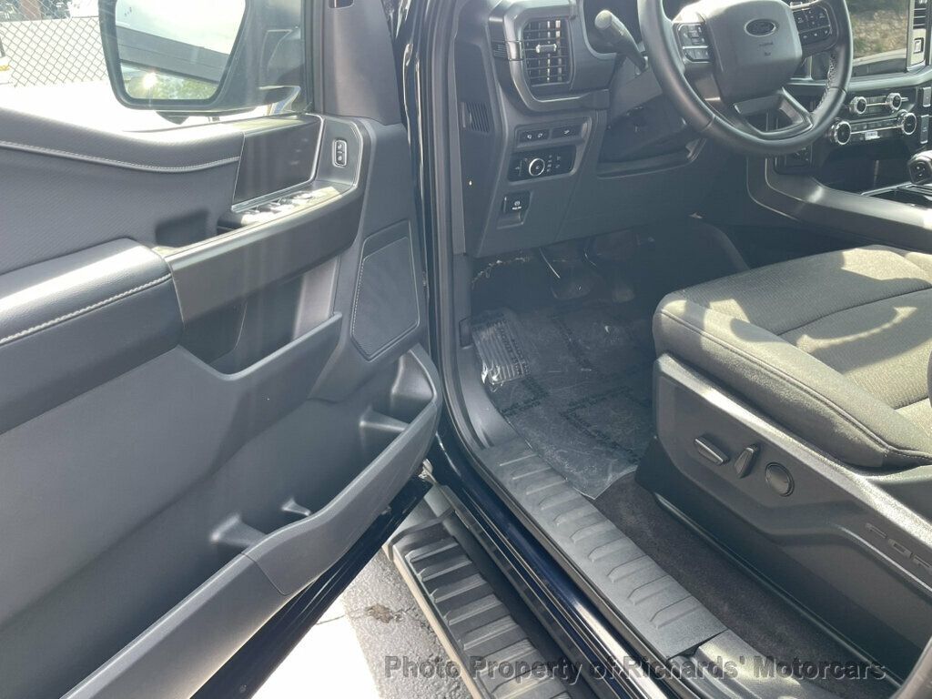 2024 Ford F-150 XLT 4WD SuperCrew 5.5' Box - Antimatter Blue Metallic exterior view 12