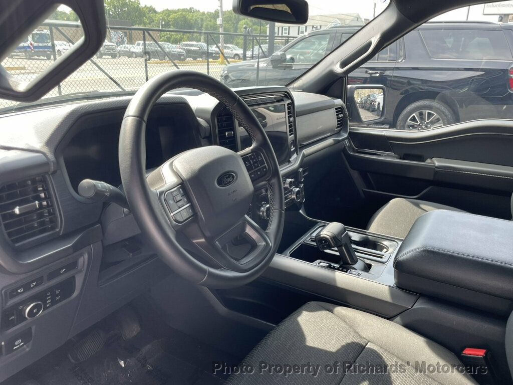 2024 Ford F-150 XLT 4WD SuperCrew 5.5' Box - Antimatter Blue Metallic exterior view 14