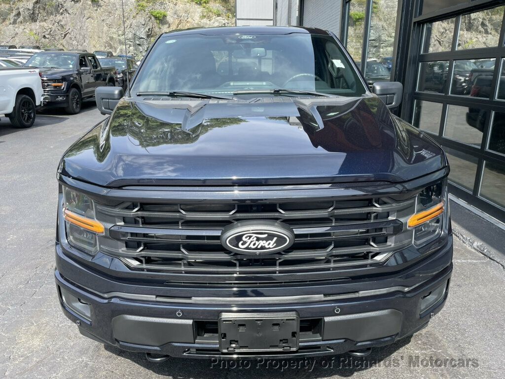 2024 Ford F-150 XLT 4WD SuperCrew 5.5' Box - Antimatter Blue Metallic exterior view 4