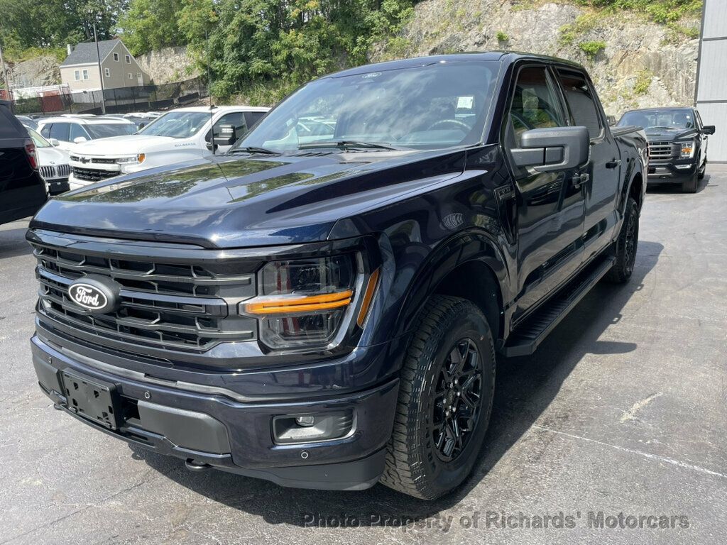 2024 Ford F-150 XLT 4WD SuperCrew 5.5' Box - Antimatter Blue Metallic exterior view 5