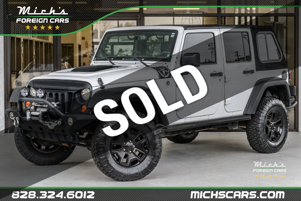 2013 Used Jeep Wrangler Unlimited UNLIMITED SAHARA - NEW TIRES - 6 SPEED  MANUAL - MUST SEE at Michs Foreign Cars Serving Hickory, NC, IID 21847940
