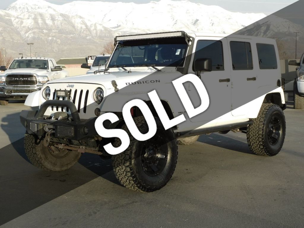 https://cdn.ebizautos.media/used-2014-jeep-wrangler_unlimited-rubicon-5234-22240658-1-1024.jpg