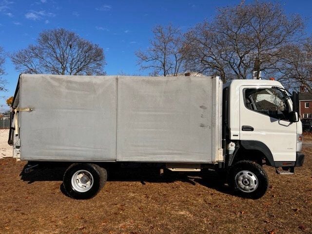 2014 Mitsubishi FUSO 4X4 STAKE BODY 13 FOOT  WITH SLIDING VINYL TOP  ONLY 6,000 MILES - 22588640 - 0