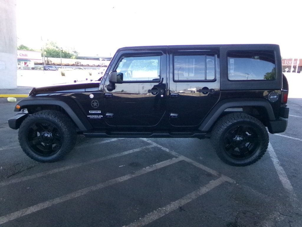 2016 Jeep Wrangler Unlimited 4WD 4dr Sport - 23021160 - 0