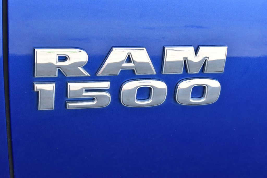 2016 Ram 1500 4WD Quad Cab 140.5" SLT - 22235131 - 50