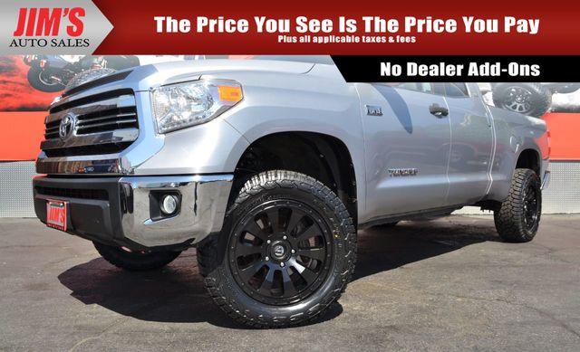 Jims Auto Sales, located in Harbor City CA, presents a Toyota Tundra featuring 20-inch Fuel Wheels, 33-inch YOKOHAMA AT tires, and a backup camera (Inventory ID: 20126579).