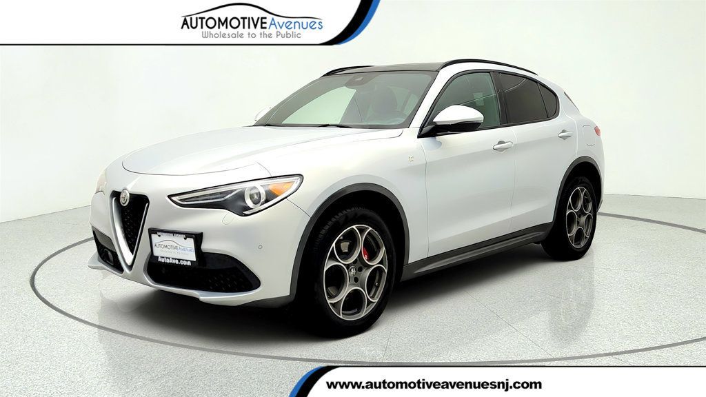2022 Alfa Romeo Stelvio Ti AWD w/ Gloss Red Calipers & Chocolate Seats - 23030662 | Video 1