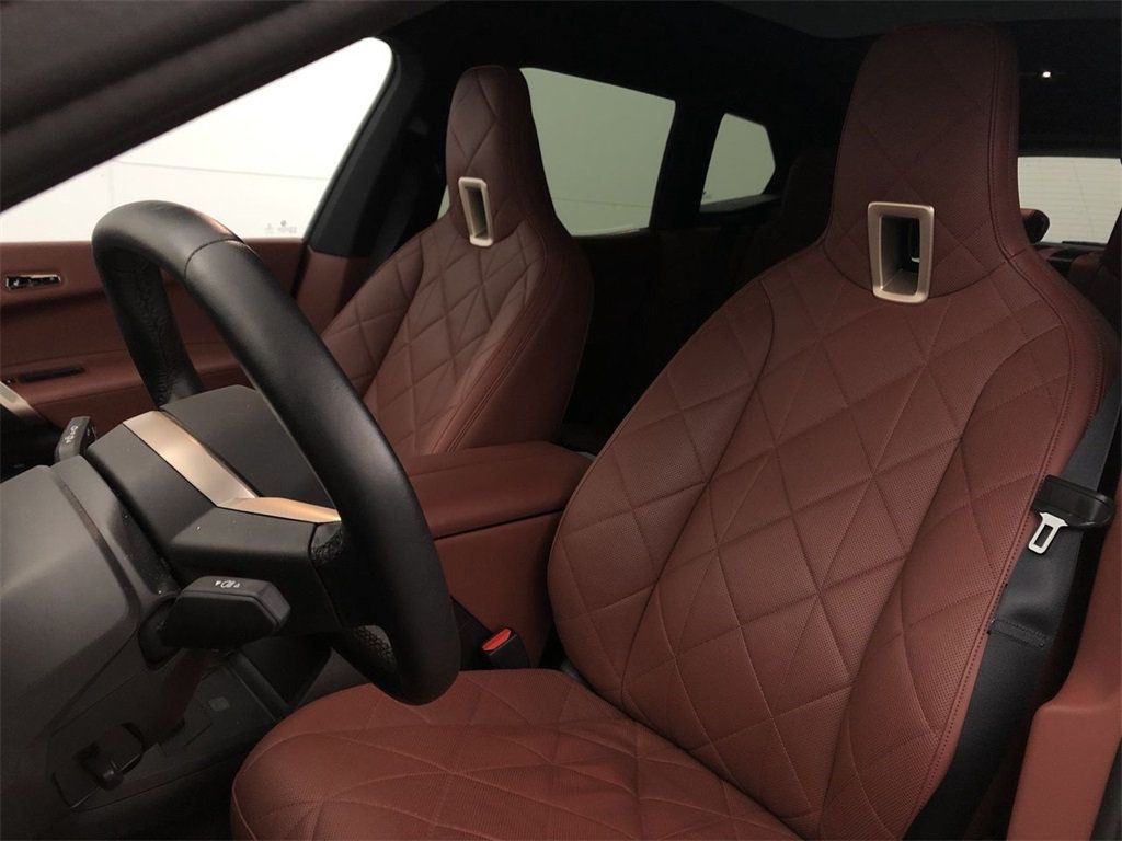 X: A Great Car with Ventilated Seats, Walnut Console, and Glass Controls